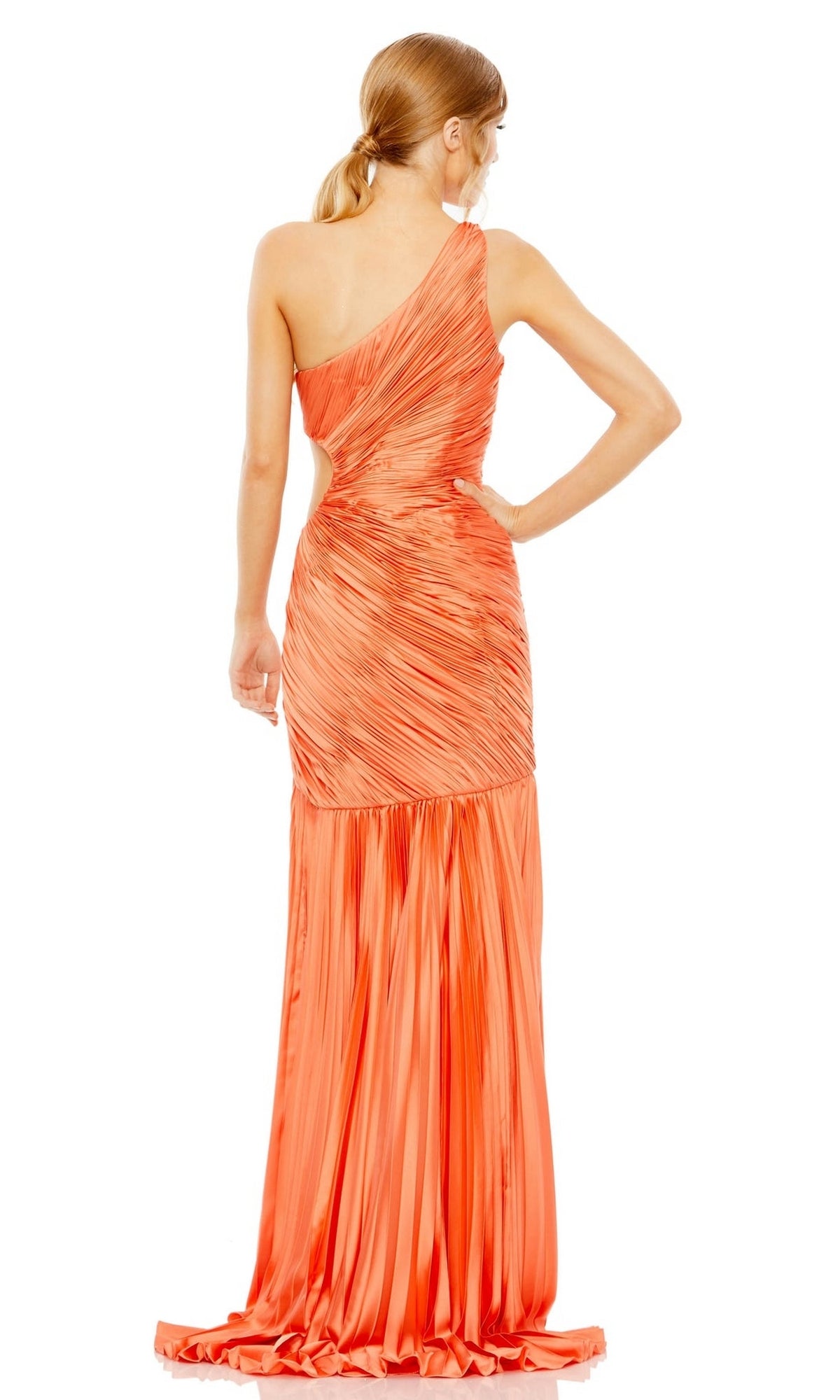 A woman faces away from the camera, modeling the Mac Duggal Long Formal Dress 49683—an orange, one-shoulder gown with a pleated skirt and a subtle side cutout.